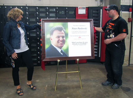 Gina Pavlovski and Steve Romios unveil plaque.