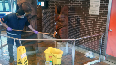 St. Julien at work on three totems.