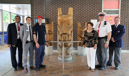Three totems and group at Spadina Station.