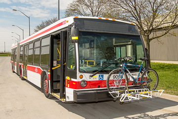 Articulated bus with locked-down bike rack.