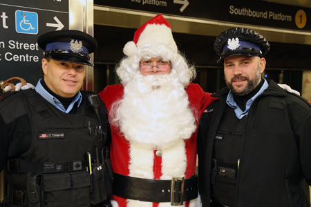 Santa and his helpers spread holiday cheer.