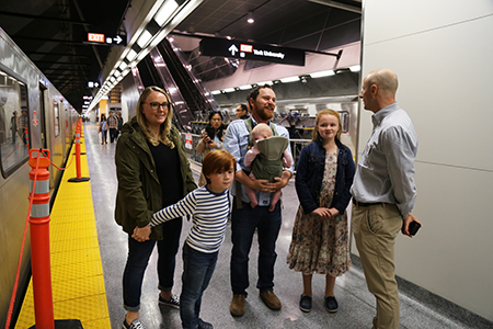 family picture of passengers during the opening  of Toronto York Spadina Subway Extension in 2017