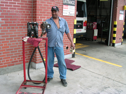 Mechanic Ahmad Rasheed and his fuel pump, August 2003.
