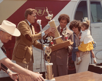 Grand Champion Bill Moore accepts trophy from CGM Michael R. Warren.